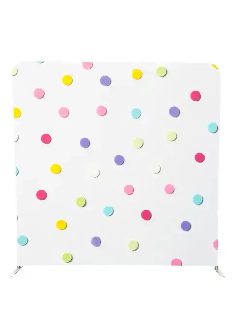 Fun colourful polka dot photo booth backdrop by Crown Booths, perfect for birthdays and playful events