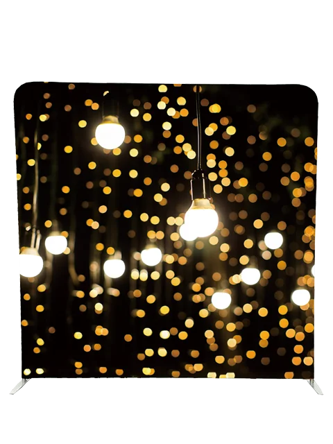 Elegant hanging lights photo booth backdrop with glowing bokeh effect by Crown Booths, perfect for nighttime and festive events.