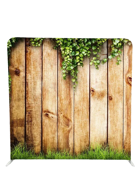 Rustic wooden fence with green ivy and grass photo booth backdrop by Crown Booths, ideal for outdoor-themed events