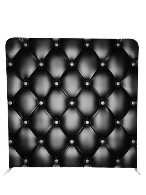 Luxurious black leather tufted photo booth backdrop by Crown Booths, perfect for upscale and elegant events