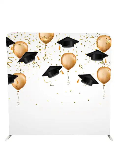 Graduation photo booth backdrop with black caps and gold balloons by Crown Booths, perfect for graduation parties and ceremonies