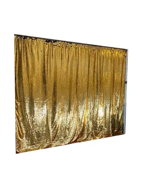 Luxurious gold sequin curtain photo booth backdrop by Crown Booths, perfect for glamorous and upscale events